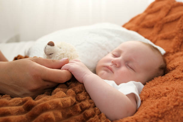 First-time parents face many questions about infant sleep. Parents are concerned about how much sleep a baby should get and how long it is best for the baby to sleep at night or get enough sleep during the day. Therefore, baby's sleep should be prioritized in baby care because adequate sleep of baby plays an important role in full development of baby. There is nothing more peaceful than seeing a baby sleeping but mothers face huge hurdles to create this scene especially at night. It is every parent's wish that their child gets enough sleep at night. Usually newborns do not want to sleep at night. If the newborns do not want to sleep then different steps should be taken. For example, wearing thin and soft clothes at bedtime and telling bedtime stories will become part of your youngster's routine. Child's age and approximate number of hours of sleep required: Newborn: 16 to 20 hours a day. Three weeks: 16 to 18 hours a day Six weeks: 15 to 16 hours a day Four month: 9 to 12 hours (day and night) Six month: 11 hours plus two to three more hours a day Nine month: 11 to 12 hours day and night with two more hours during the day. One year: 10 to 12 hours day and night with two more hours during the day. 18 month: 13 hours in day and night 2 years: 11 to 12 hours 3 years: 10 to 11 hours Sleep time in the Newborn: Your newborn baby does not know the difference between day and night. He needs to sleep and feed constantly so day or night is not very important to him. In general, newborns should sleep 16 to 18 hours a day. He'll wake up sometimes and he'll be hungry. You need to treat him differently at different times to teach him the difference between day and night. Talk to him more during daytime seat feedings and be calmer and use a softer tone during nighttime feedings. Over time, he will learn the difference between day and night and start sleeping more at night. How does a three week old baby sleep? Newborn babies usually sleep three to four hours uninterrupted at night. And breastfeed the baby when he wakes up at night. Thus the baby sleeps uninterruptedly for some time. Remember that if you breastfeed your baby, your hormones will adjust to your baby's sleep patterns. Your hormones can help prevent sleep disorders. Babies who are fed starter milk tend to sleep longer. Because it stays in their stomach longer. If your baby sleeps throughout the day, you should try to wake him up for feedings. Teach the child that the longest association of sleep is night. Help integrate the child into the center of family activities in the afternoon. If she is still asleep, help her sit upright in a baby chair or baby carrier or rocking chair and bathe her around 7 or 8 pm. This will keep him awake while also helping him get a long restful night's sleep. How long does a two month old baby sleep? If the baby is two months old, he is starting to sleep on his own. However, he may still need to be woken for nighttime feedings. Although the sleep patterns have started to become regular. You should monitor it closely. Establishing a schedule is very important. Swaddling the baby to sleep is also not advisable. Babies sleep a little less at this age than newborns. At home they sleep around 14 to 15 hours. Your baby will sleep most of these hours at night. Although he usually does not sleep straight away and will be awake for long periods of time during the day. It depends on the baby if he can sleep about three times a day. It is normal for the baby to cry when he wakes up. If she wakes up and cries, give her time to calm down and breastfeed.