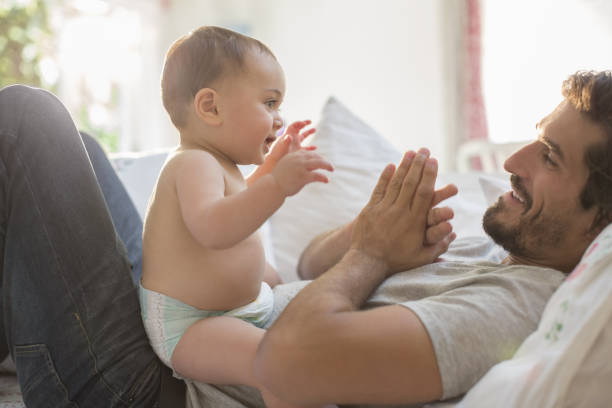 After birth, newborns usually try to communicate with their parents through smiling facial expressions and body gestures. We'll share some basic tips on your baby's body language that can help explain your baby's needs to communicate emotions and feelings in the first months of life. A baby's giggles, grunts, babblings are all the first forms of communication with their parents, And which tries to evoke sympathy for the child in you. Body language is very effective from the moment a baby is born. Tries to convey a lot with his body gestures without the need for words. *Newborns try to express their permission through some physical gestures during the first week of life and this is normal for all babies. Which helps you to keep the baby longer. *When the newborn grasps the parents' fingers with their small hands, they apply light pressure to their palms. This response tells the parents that they need something and that excites the adults. This is due to the grasping reflex. *Another response in newborns is to open their arms when their back is arched or when parents pick them up from the bed. It is the Moro reflex that is activated when the newborn has a sensation of falling. *Among the instinctive reflexes are some disturbing impressions that are common in the mouth of infants of a few months of age a child's mouth is seen when he does not taste anything other than the sweet taste of milk. *All these gestures are involuntary but they mimic reluctance to bond with parents. Those who respond to the child's attitude when they hold the child in their arms, talk to him or smile at him.